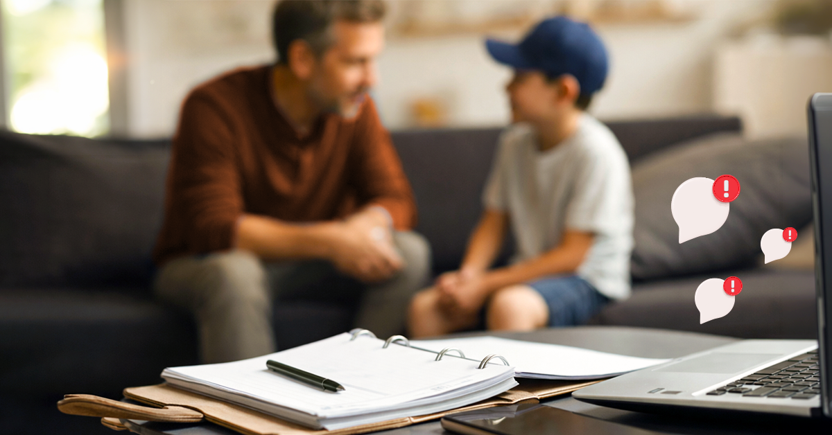 Father and son on couch with laptop and notification alerts
